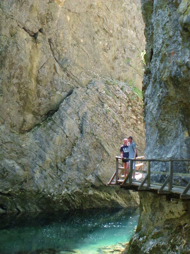 A couple on a wooden platform in Vintgar Gorge