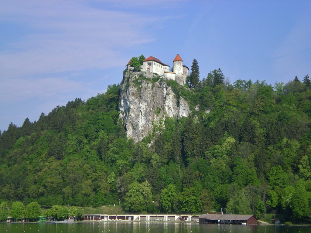 Bled Castle jutting out of trees above Lake Bled