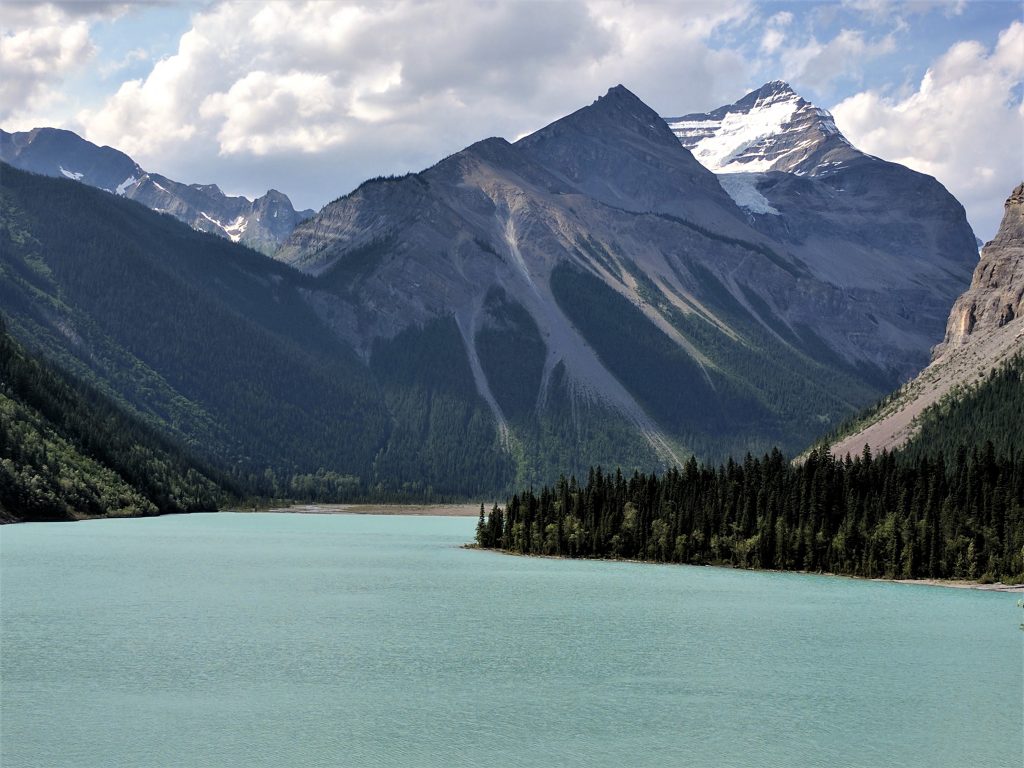 A glacially-colored Kinney Lake in front of imposing mountains
