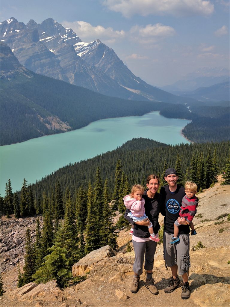 A family with young children overlooking Peyto Lake in the Canadian Rockies