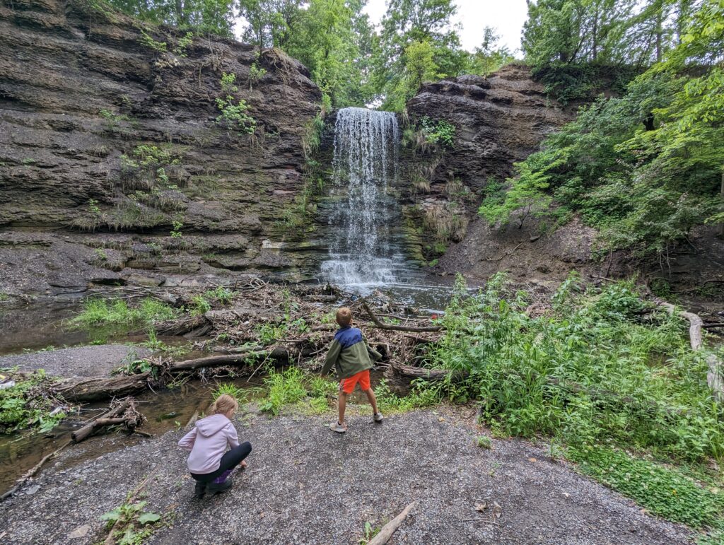 Children playing at the foot of Day's Dam Falls