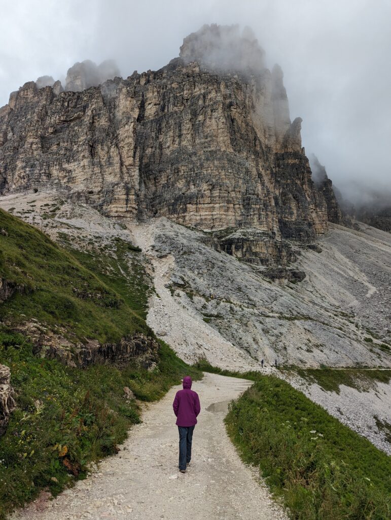 A hiker on the trail around Tre Cime in the Dolomites