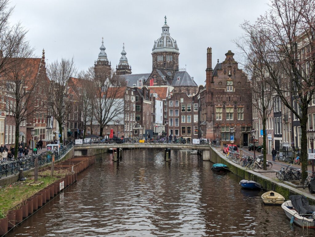 A canal in Amsterdam leading to the Basilica of Saint Nicholas 