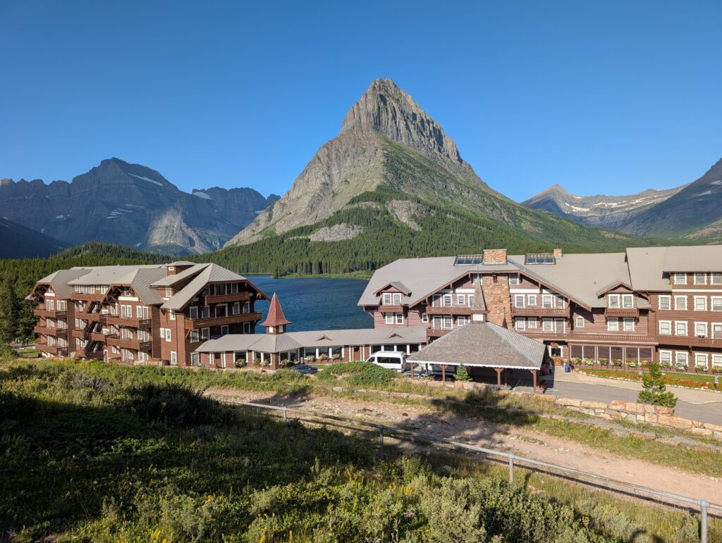 Many Glacier Hotel in front of a large, pointy mountain