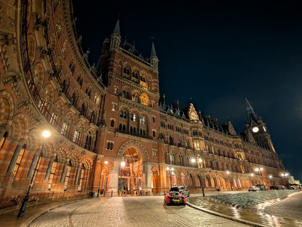 A large gothic hotel lit up at night in London