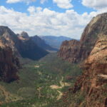 An elevated view looking down a deep, wide canyon on a cloudy day