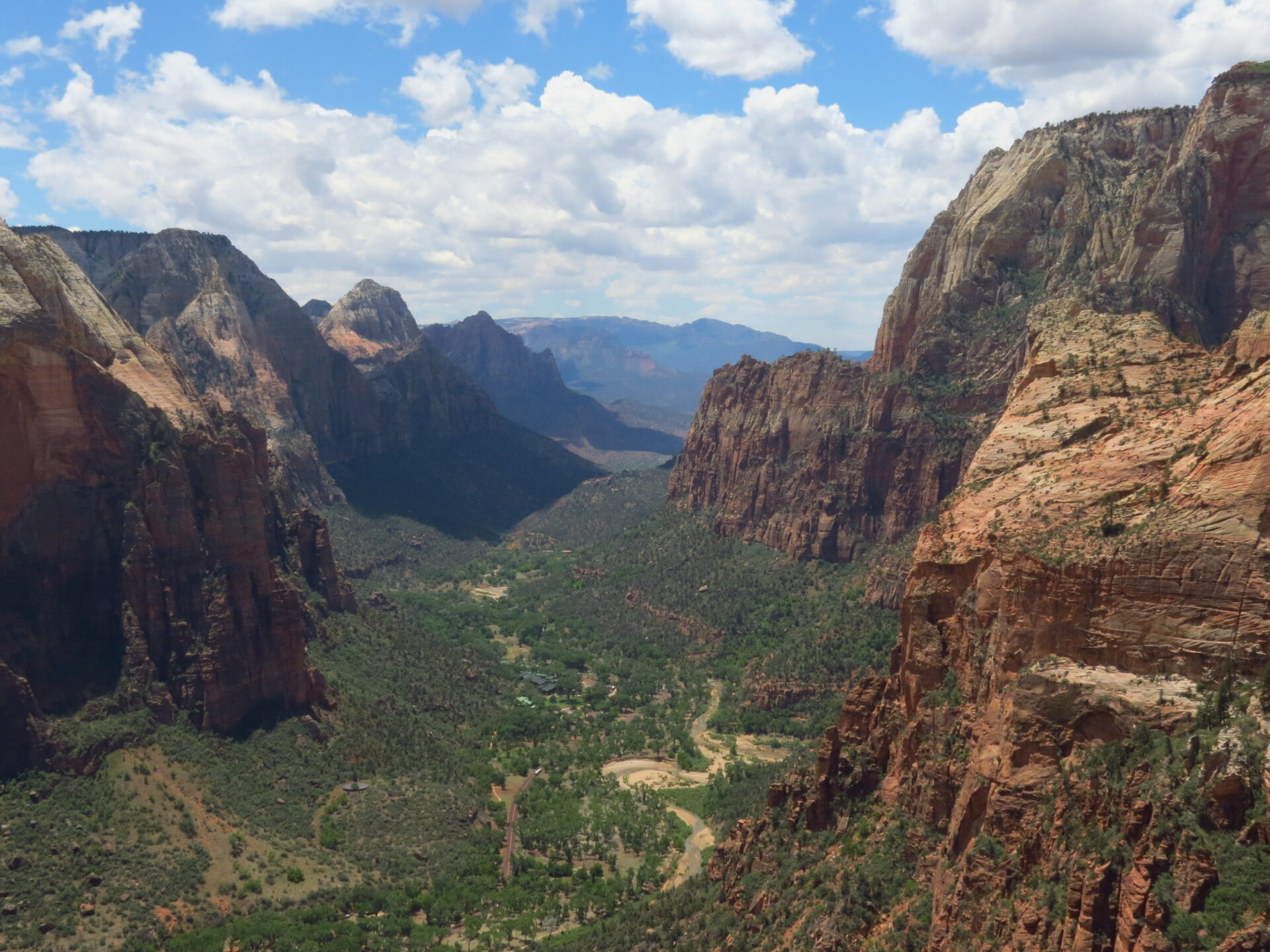 An elevated view looking down a deep, wide canyon on a cloudy day