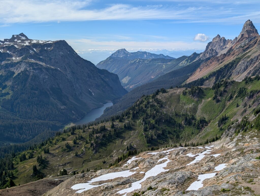 A small body of water in a valley surrounded by mountains in the North Cascades